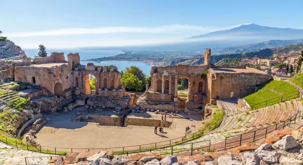 View of Taormina with Theatre of Taormina and Mount Etna, Sicily, Italy