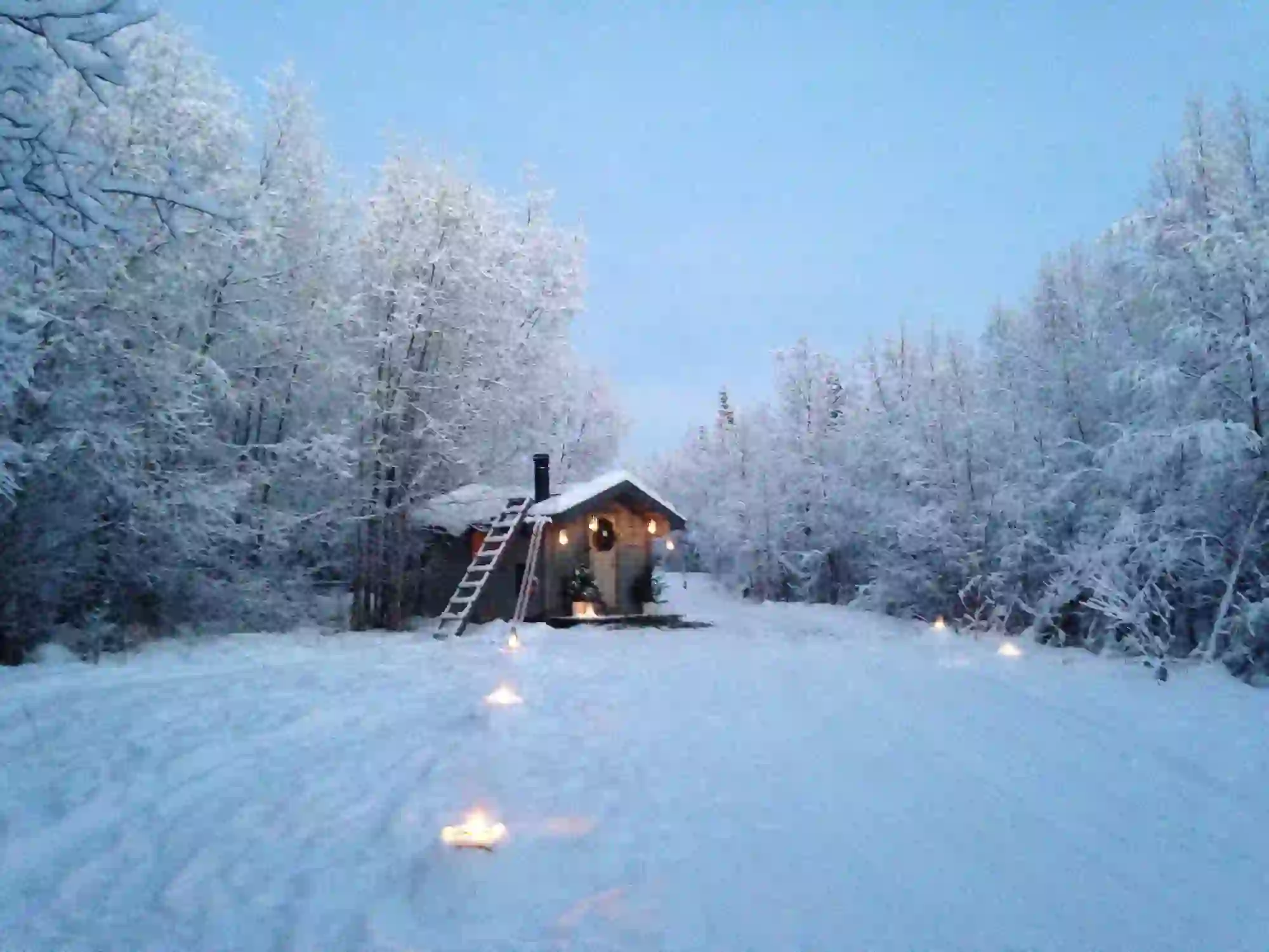 A cabin in the snowy woods in Pajala, Lapland