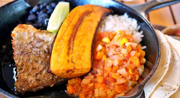 Traditional Costa Rican casado meal with rice, beans and plantains