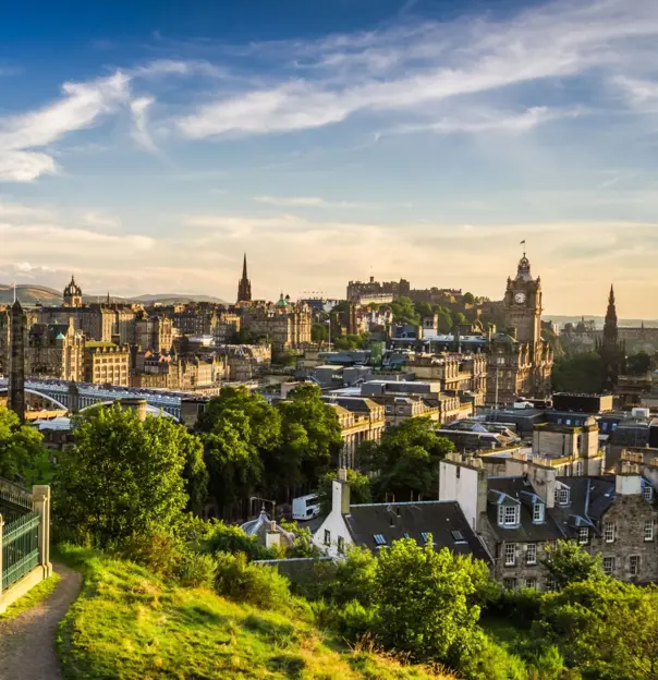 Edinburgh skyline at sunset from Calton Hill, with the Dugald Stewart Monument in the foreground
