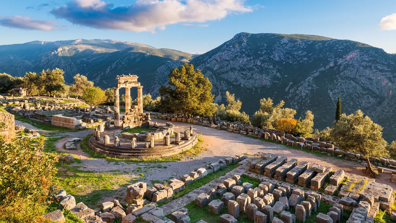 High angle shot of ruins of a temple with mountains in the distance