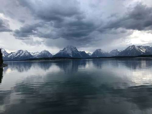 The calm lake and icy peaks of Grand Teton National Park