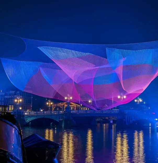 View of Amsterdam during the Light festival in the Netherlands at night