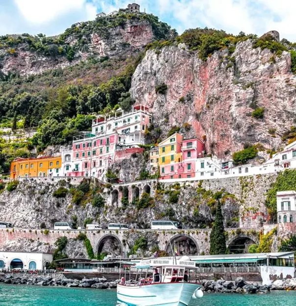 The Amalfi Coast View From Water, showing the buildings along the rock in the cliff