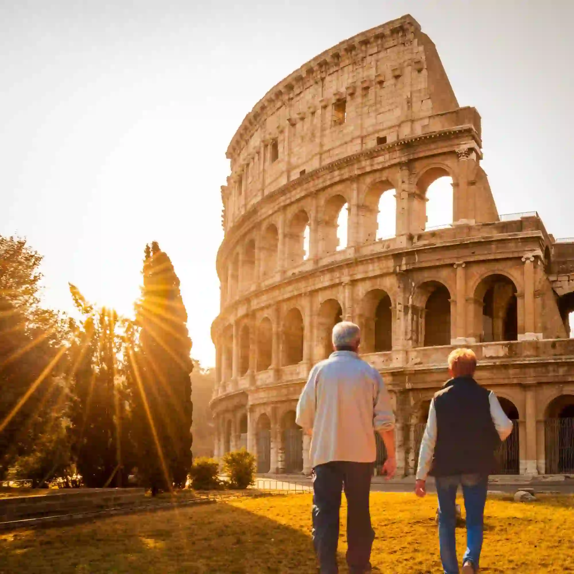 Senior Couple walking towards the Colosseum in Rome