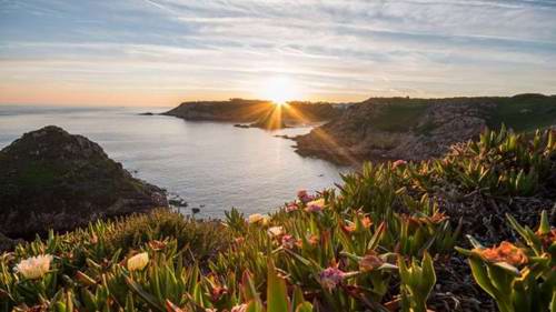 The sun sets near Noirmont Point