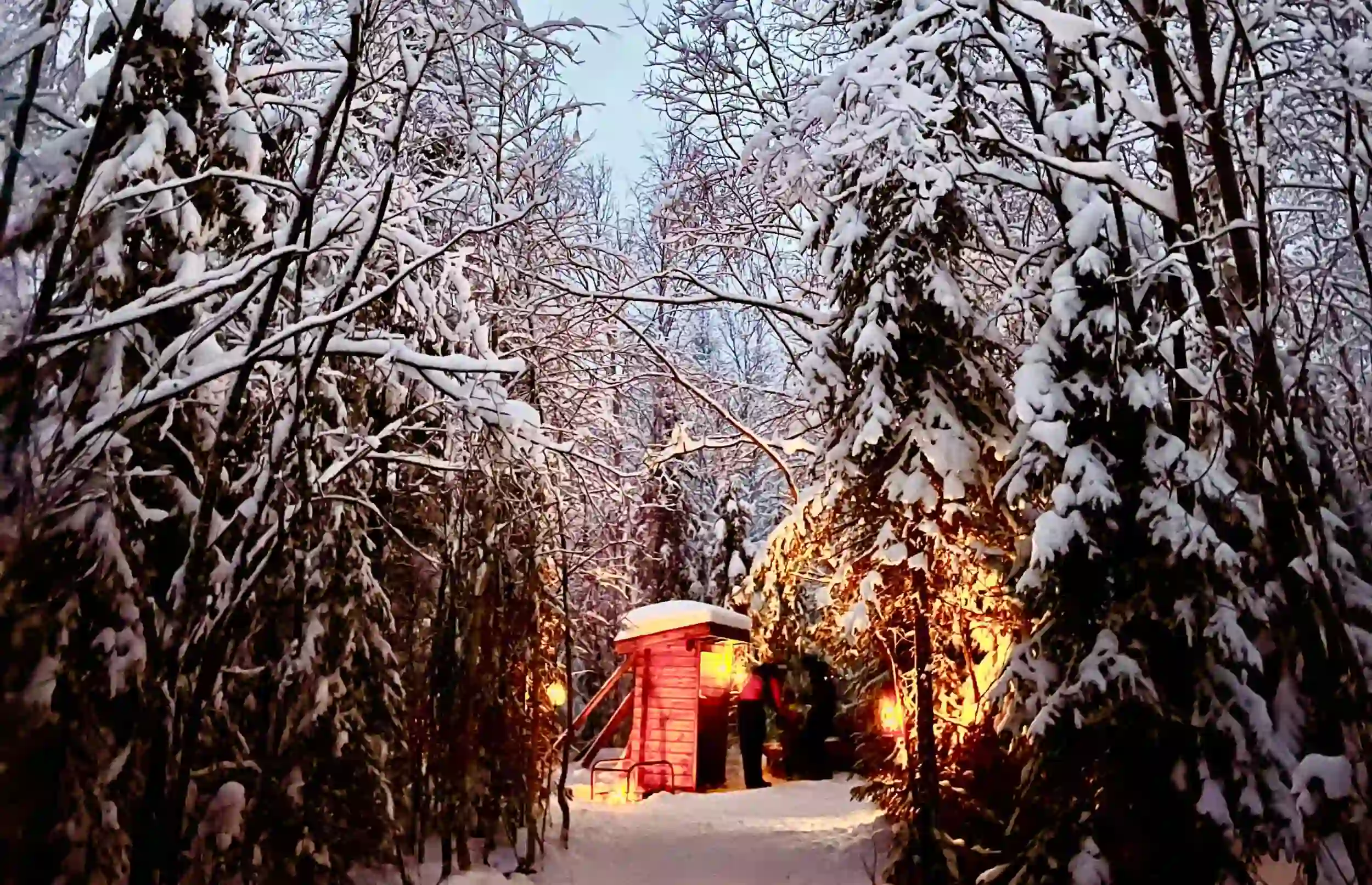 Small cabin in the snowy woods in Lapland