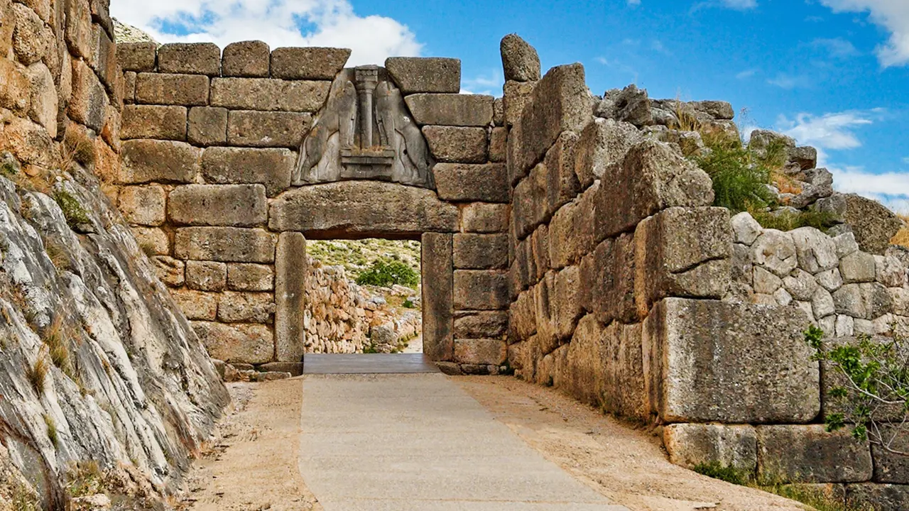 Ancient wall with an arch, with pathway going through it