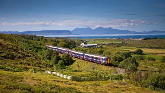 A Sprinter Mallaig Line train going along the railway in the Scottish Highlands