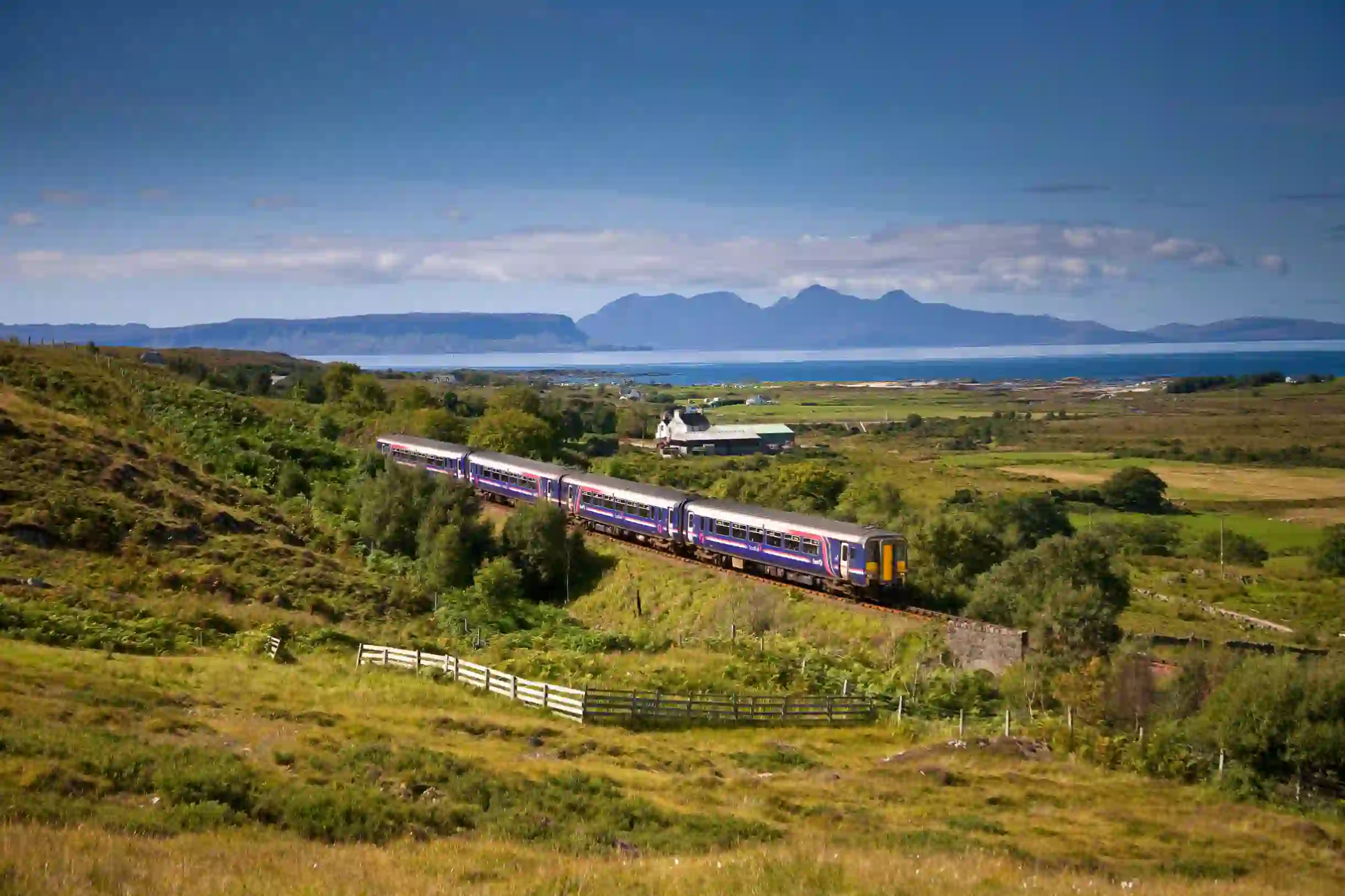 A Sprinter Mallaig Line train going along the railway in the Scottish Highlands