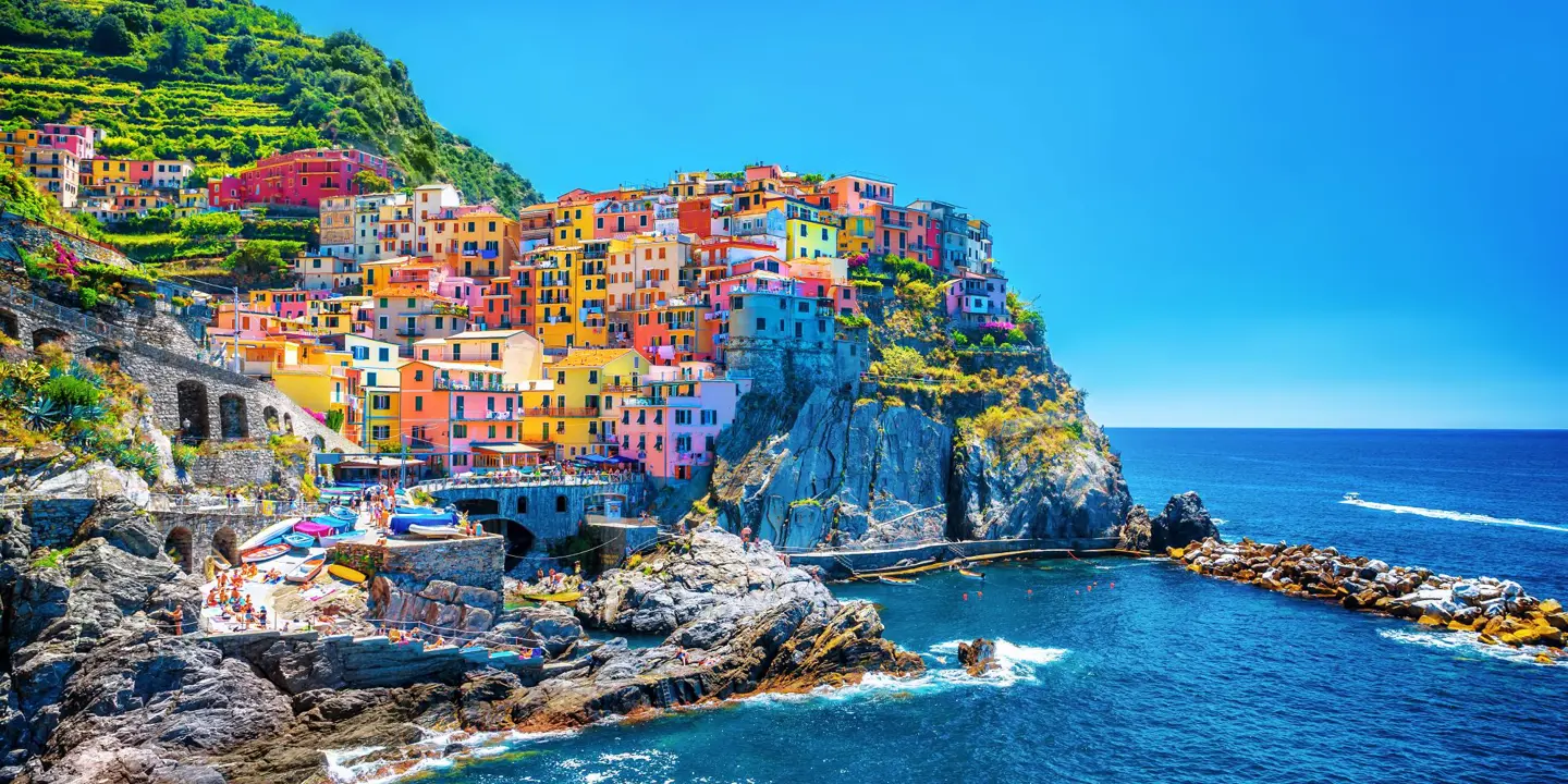 The colourful town of Cinque Terre on a cliff overlooking the sea