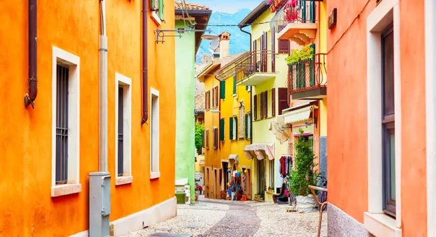 Small street in Malcesine, Lake Garda with colourful houses