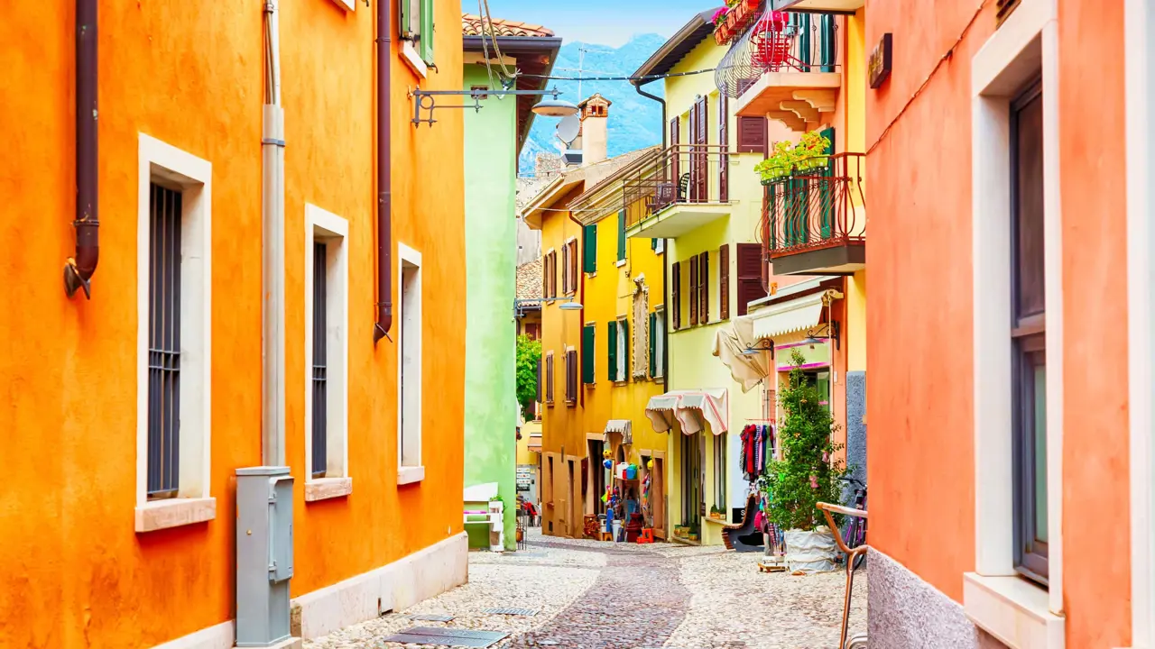 Small street in Malcesine, Lake Garda with colourful houses