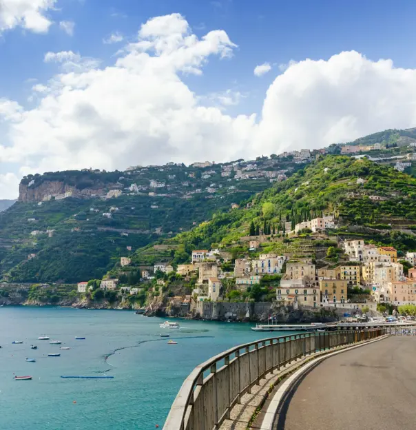 Road On The Amalfi Drive, showing the sea with boats and a mountain