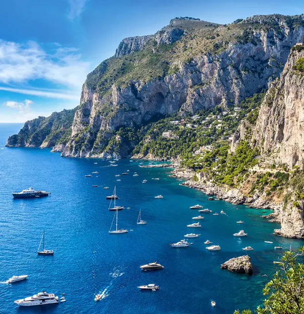 Bay of Capri with cliffs and boats