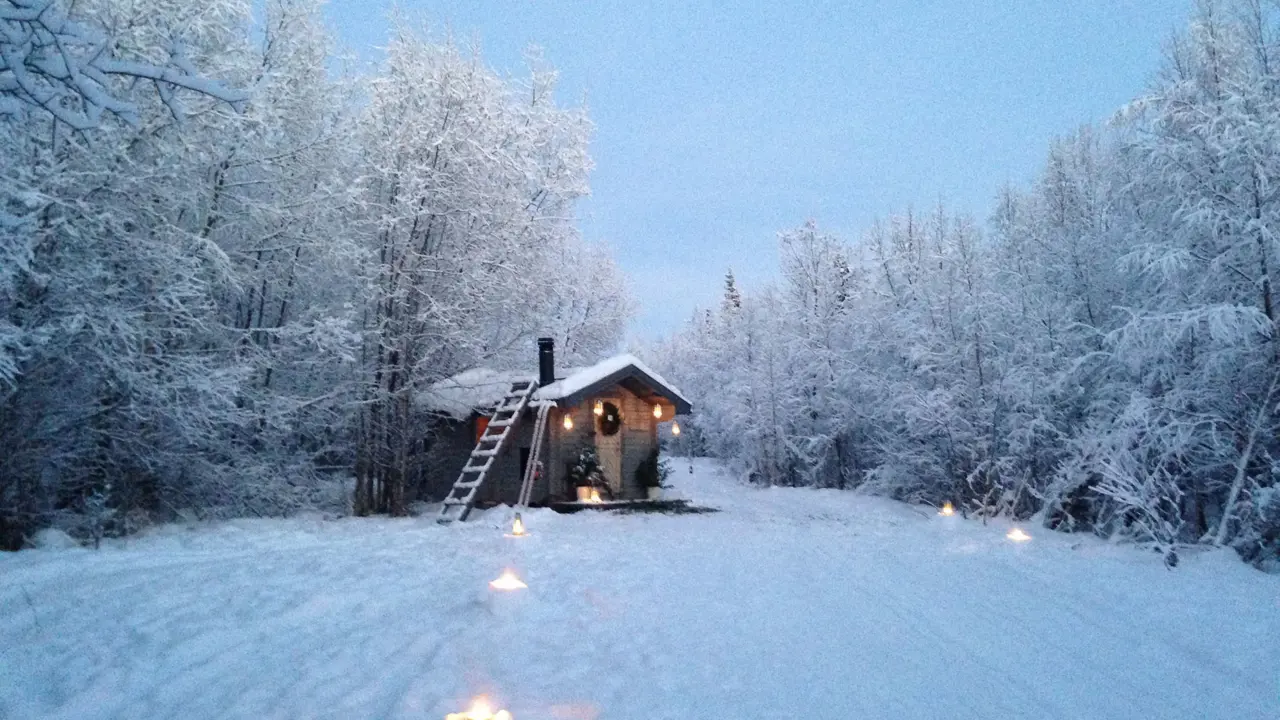 A cabin in the snowy woods in Pajala, Lapland 