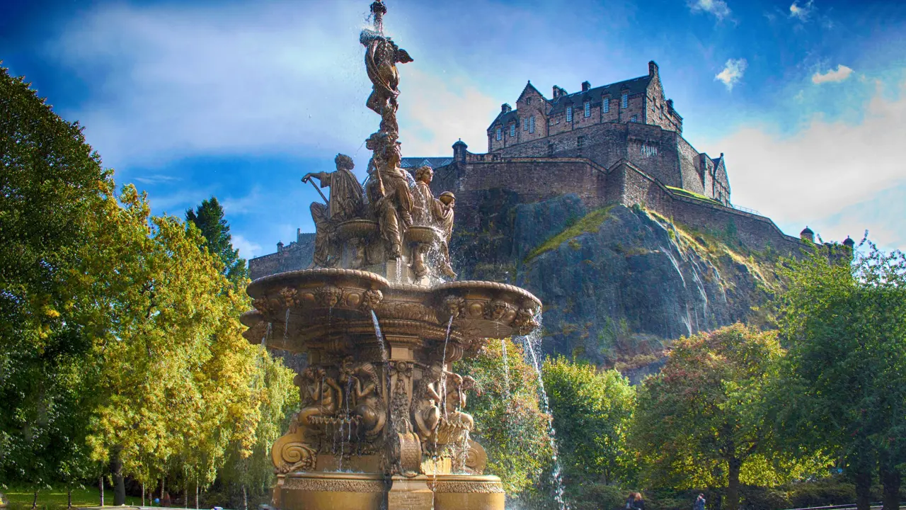 Shot of Edinburgh Castle on the top of the hill and Ross fountain in the forefront