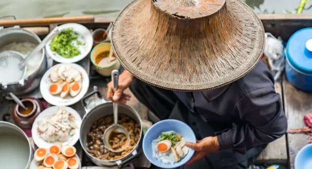 Image of person preparing Thai Food on Floating Market