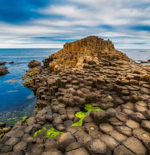 Giant's Causeway bumpy rock formation, with the view of the sea