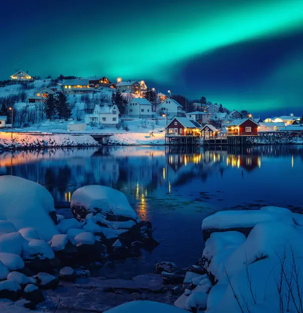 Scenic photo of winter fishing village with northern lights. stunning natural background. Picturesque Scenery of Reinefjord one most popular place of Lofoten islands. 