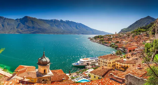 Bay of Limone Lake Garda, showing builidngs and a boat